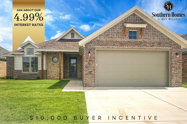 view of front of property featuring a garage and a front yard