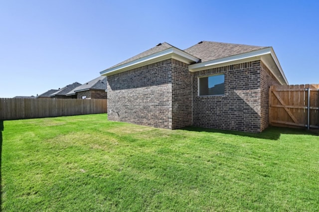 view of home's exterior featuring a yard