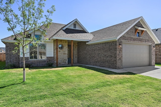 view of front of home featuring a garage and a front lawn