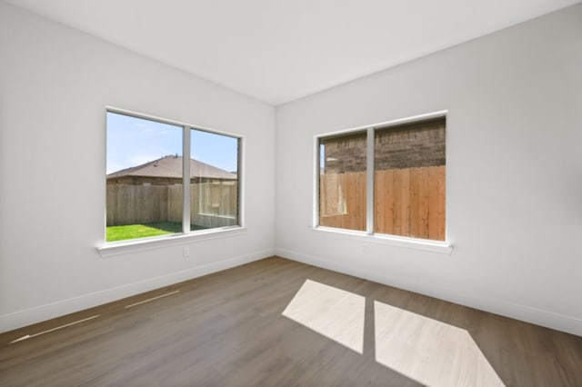 spare room featuring dark hardwood / wood-style flooring