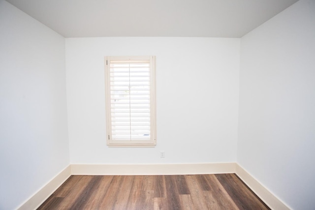 empty room featuring dark wood-type flooring