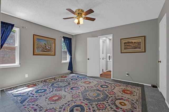 2004 Rice Dr, Levelland, TX 79336 - bedroom with a textured ceiling, ceiling fan, and baseboards