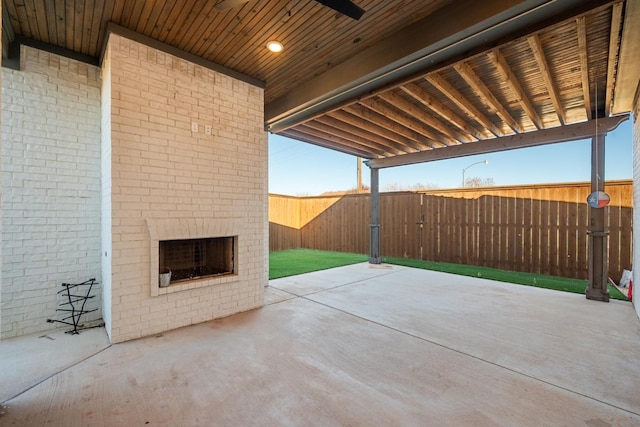 view of patio / terrace featuring fence