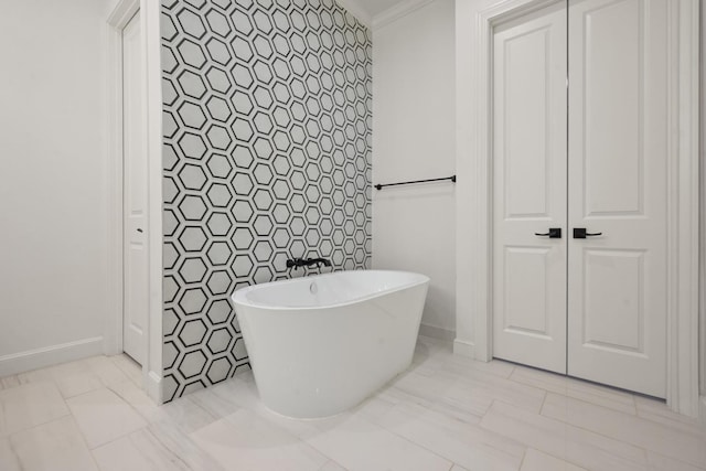 bathroom with a freestanding bath and tile walls