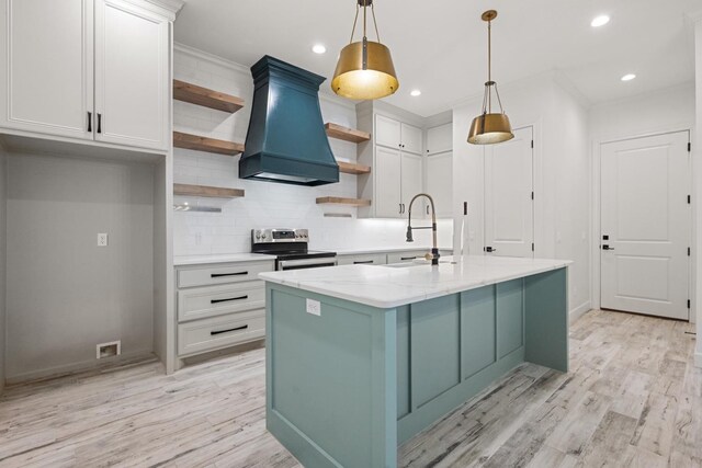 kitchen with light wood-type flooring, custom range hood, open shelves, a sink, and stainless steel electric range