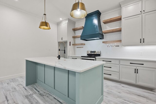 kitchen with tasteful backsplash, custom range hood, light wood-style floors, electric range, and open shelves