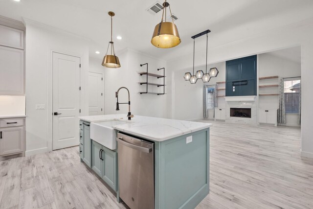 kitchen with visible vents, a premium fireplace, a sink, dishwasher, and light wood-type flooring