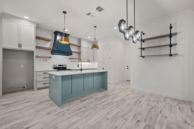 kitchen with visible vents, light countertops, electric stove, and open shelves