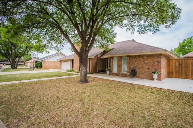 7802 Zoar Ave, Lubbock, TX 79424 - ranch-style home featuring driveway, brick siding, an attached garage, and a shingled roof