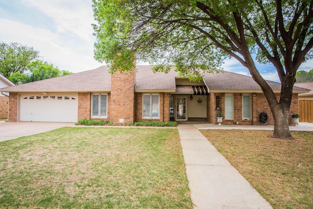 7802 Zoar Ave, Lubbock, TX 79424 - view of front of home featuring brick siding, a garage, driveway, and a front yard