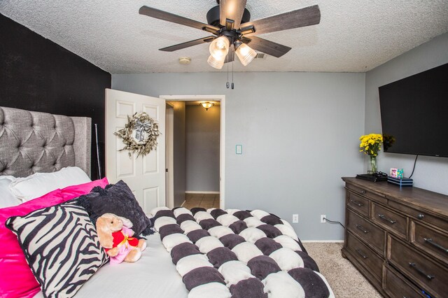 7802 Zoar Ave, Lubbock, TX 79424 - bedroom featuring a textured ceiling, light carpet, and ceiling fan