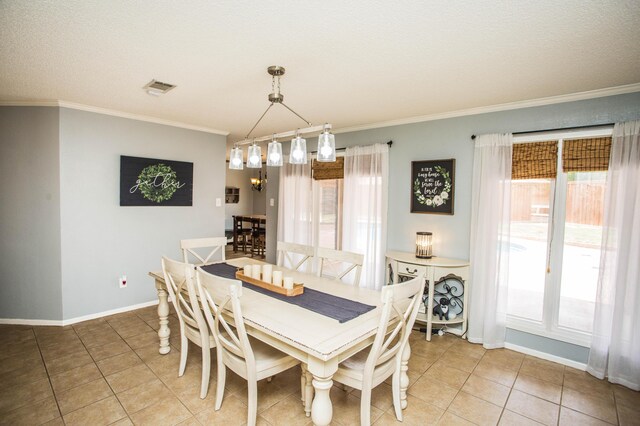 7802 Zoar Ave, Lubbock, TX 79424 - dining space featuring healthy amount of natural light, light tile patterned floors, and ornamental molding