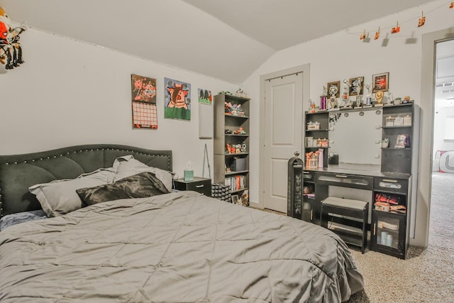 carpeted bedroom featuring vaulted ceiling