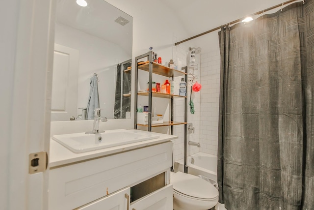 full bathroom with vanity, toilet, and shower / bath combo with shower curtain