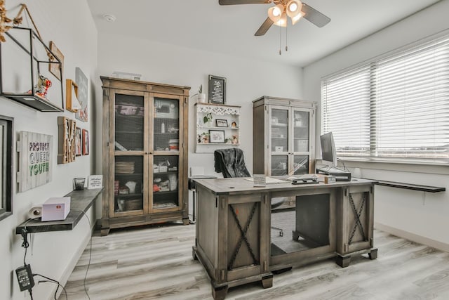 office area with ceiling fan and light hardwood / wood-style floors