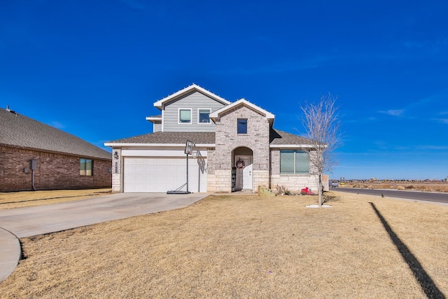 view of property with a garage and a front lawn