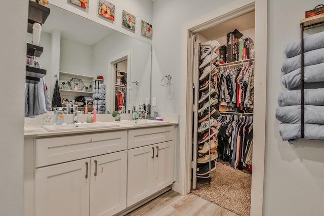 bathroom featuring vanity and hardwood / wood-style floors