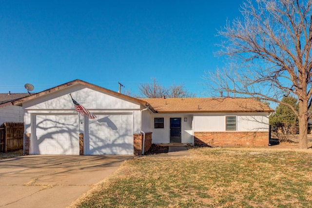 single story home featuring a garage and a front lawn