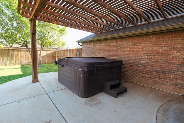 view of patio / terrace featuring a pergola and a hot tub