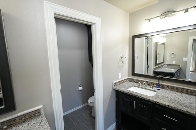 bathroom with vanity and toilet