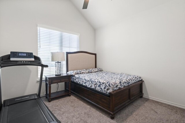 bedroom featuring lofted ceiling, light colored carpet, and ceiling fan