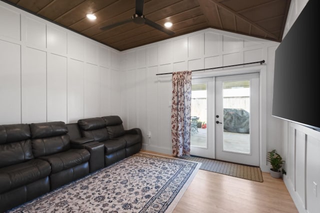 living room featuring lofted ceiling, wood ceiling, ceiling fan, french doors, and light wood-type flooring