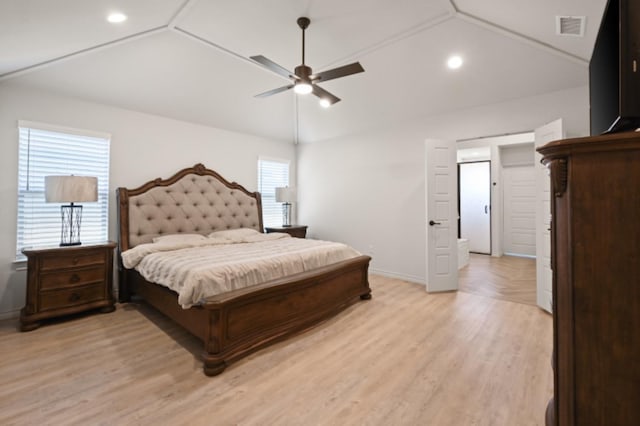 bedroom featuring vaulted ceiling, light hardwood / wood-style floors, and ceiling fan