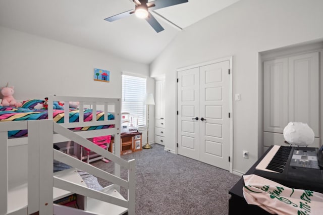 bedroom featuring ceiling fan, carpet flooring, vaulted ceiling, and a closet