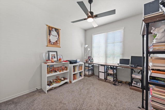 carpeted home office with ceiling fan