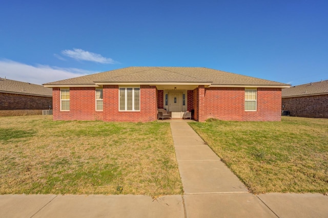 ranch-style home with a front lawn