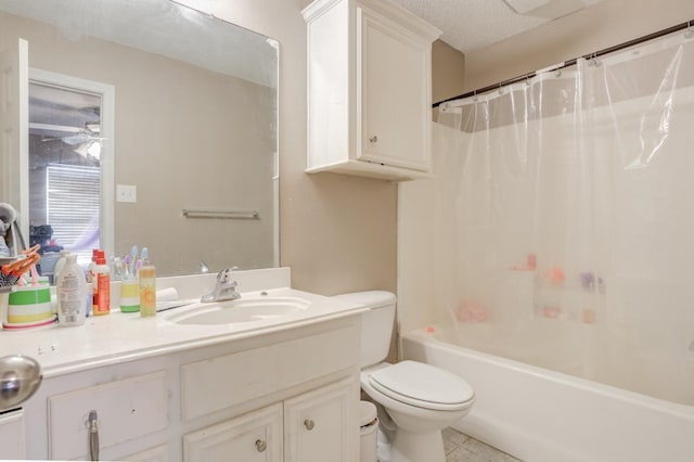 full bathroom featuring shower / tub combo with curtain, tile patterned flooring, vanity, a textured ceiling, and toilet