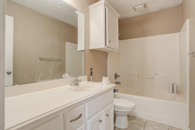 full bathroom featuring shower / tub combination, vanity, toilet, tile patterned floors, and a textured ceiling