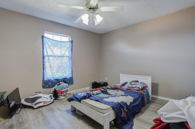 full bathroom with shower / tub combination, vanity, toilet, tile patterned floors, and a textured ceiling