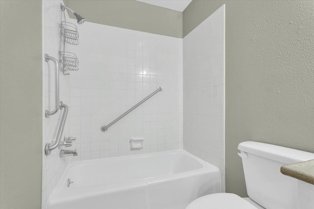 4802 54th St, Lubbock, TX 79414 - full bath featuring toilet, shower / bath combination, and a textured wall