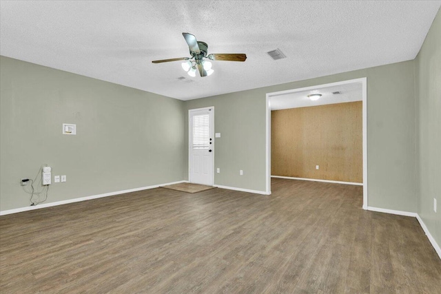 4802 54th St, Lubbock, TX 79414 - empty room featuring wood finished floors, baseboards, a ceiling fan, and a textured ceiling