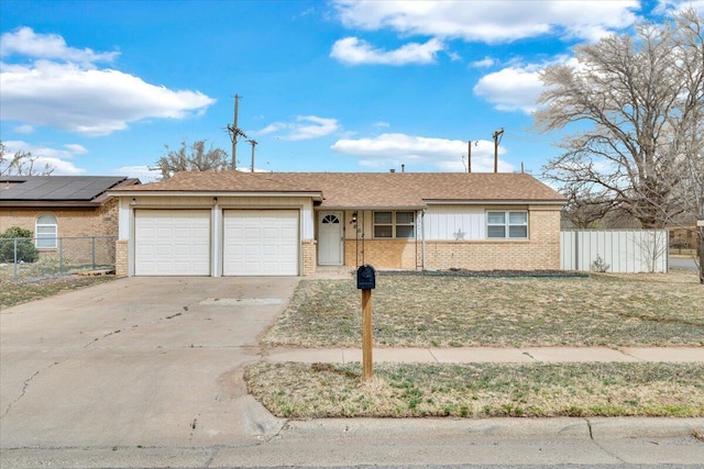 4802 54th St, Lubbock, TX 79414 - ranch-style house featuring brick siding, an attached garage, and driveway