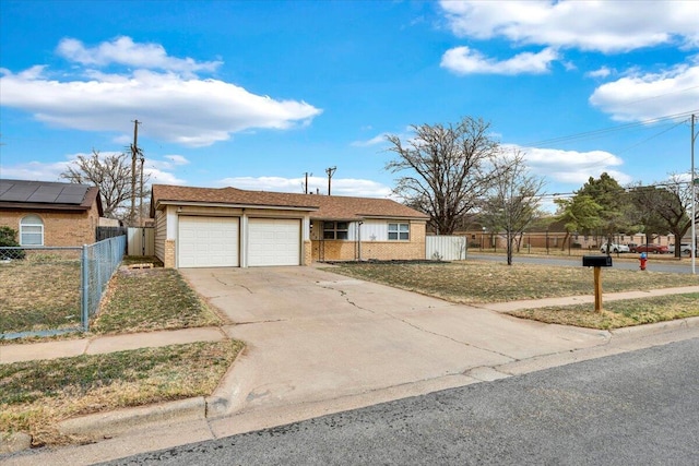 4802 54th St, Lubbock, TX 79414 - view of front facade with a garage, driveway, and brick siding