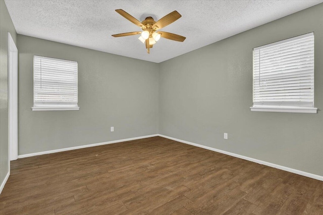 4802 54th St, Lubbock, TX 79414 - spare room with wood finished floors, a ceiling fan, baseboards, and a textured ceiling