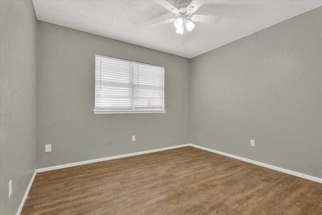 4802 54th St, Lubbock, TX 79414 - spare room with wood finished floors, ceiling fan, baseboards, and a textured ceiling