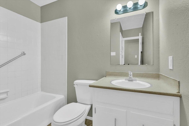 4802 54th St, Lubbock, TX 79414 - bathroom featuring toilet, vanity, a textured wall, and  shower combination
