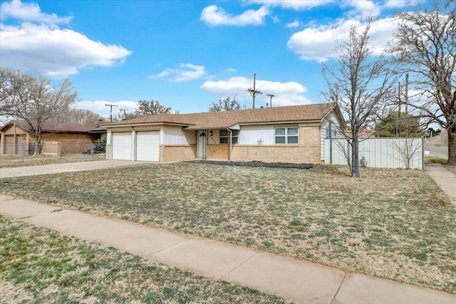 4802 54th St, Lubbock, TX 79414 - single story home with brick siding, a garage, and driveway