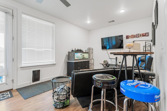 interior space featuring recessed lighting, visible vents, ceiling fan, wood finished floors, and baseboards