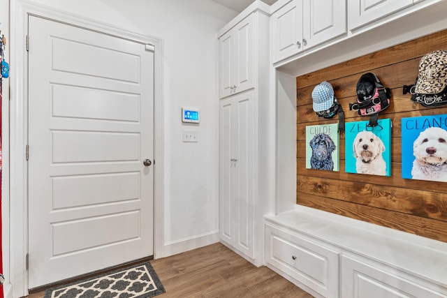 mudroom with light wood-type flooring and baseboards