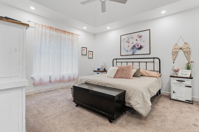 bedroom with recessed lighting, light colored carpet, and baseboards