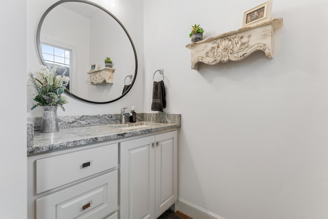 bathroom featuring vanity and baseboards