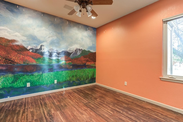 unfurnished room featuring ceiling fan and hardwood / wood-style floors