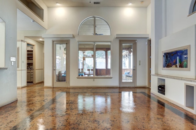 foyer featuring a high ceiling