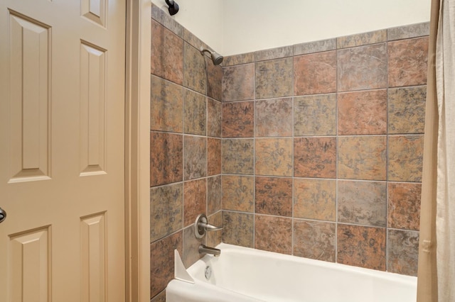 bathroom featuring shower / bathtub combination with curtain