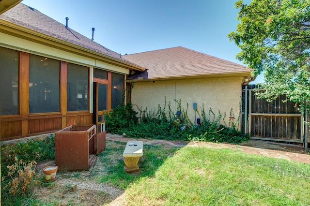 view of yard featuring a sunroom