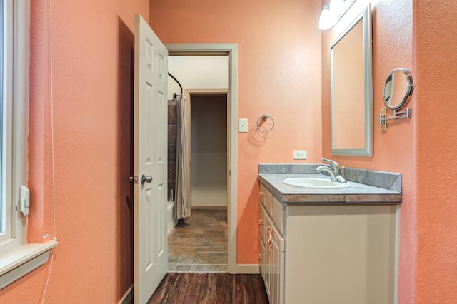 bathroom with vanity and wood-type flooring